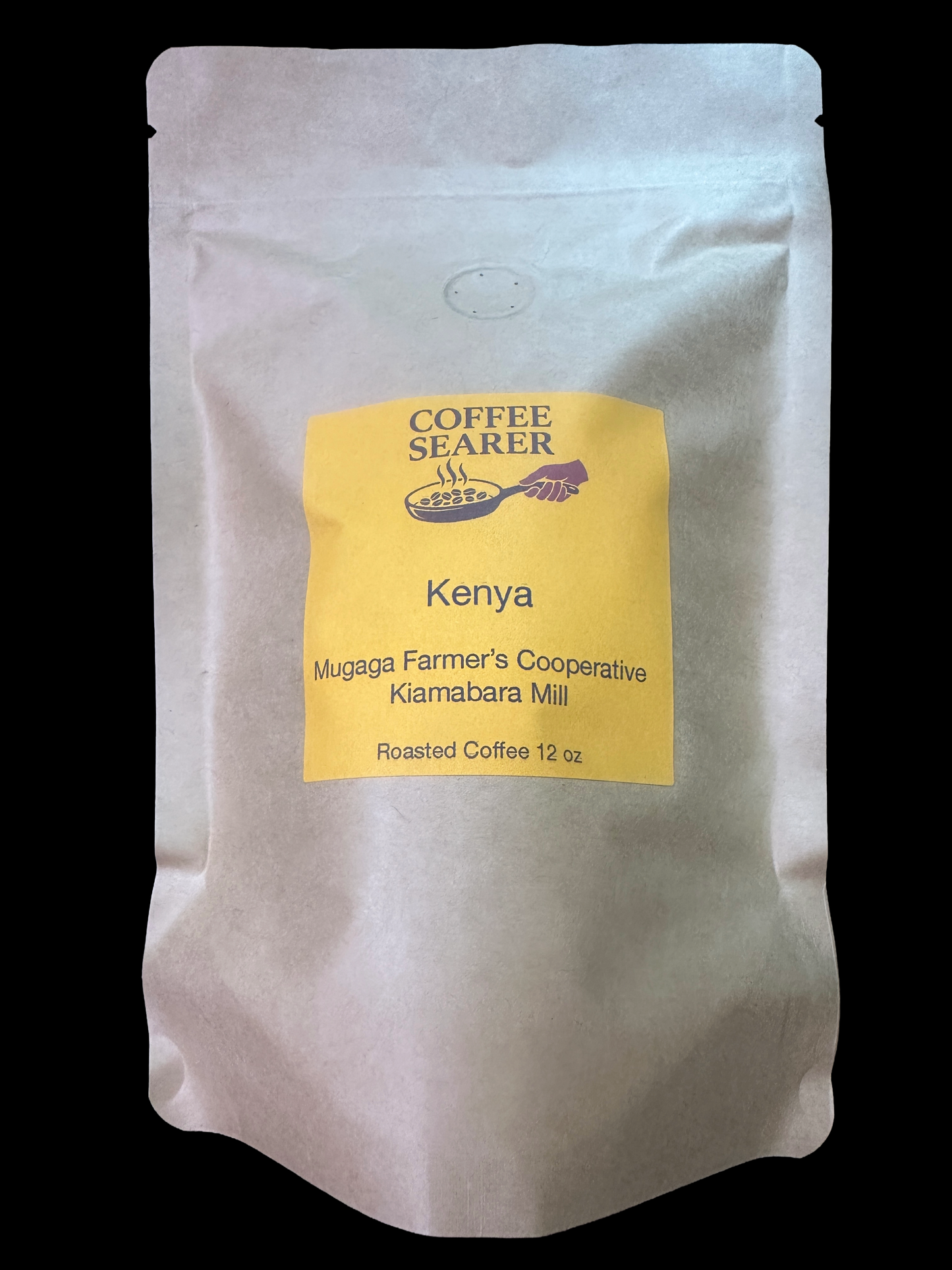 A 12 oz stand-up pouch of Coffee Searer Kenya roasted coffee, featuring a yellow label on a white background against a black backdrop.